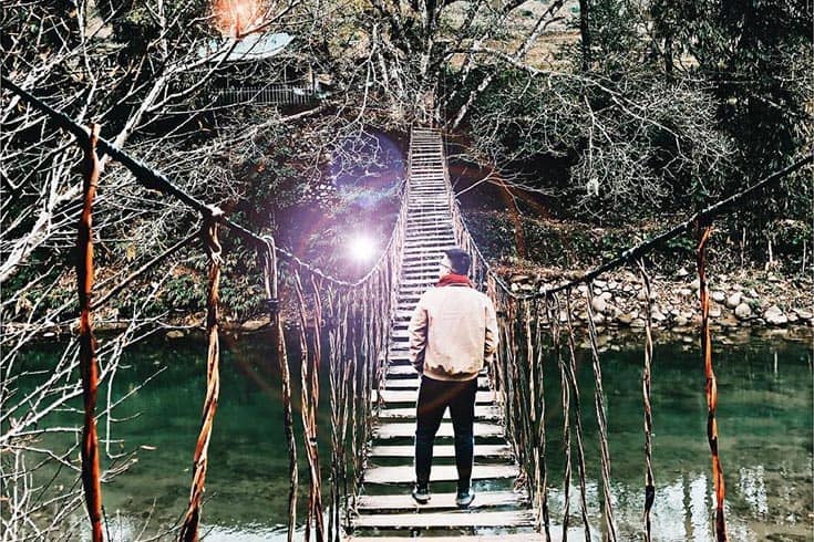 Tourist takes picture at Cloud Bridge in Sapa