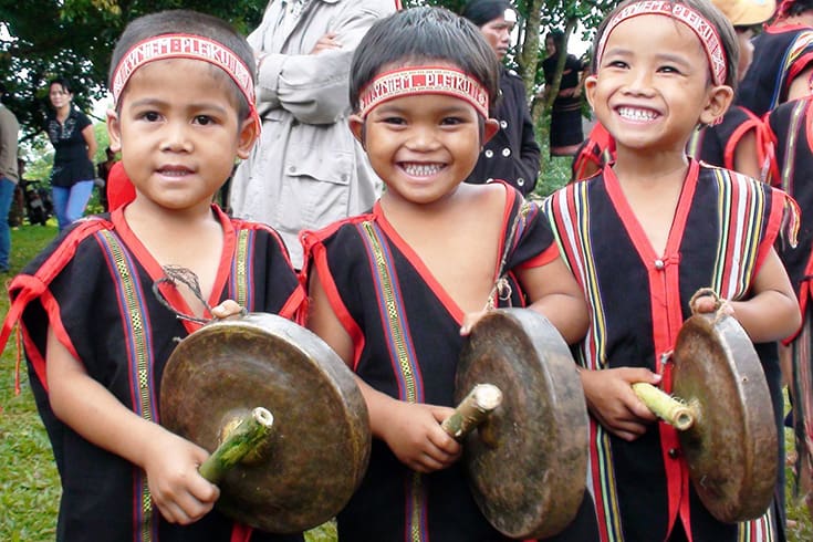 Culture value - Smile of ethnic group kids with gong