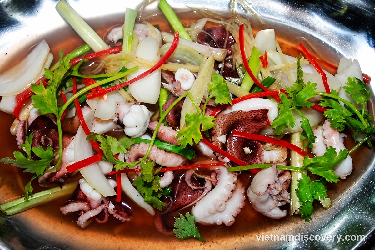 Steamed octopus with ginger, spring onion, chilli and herbs
