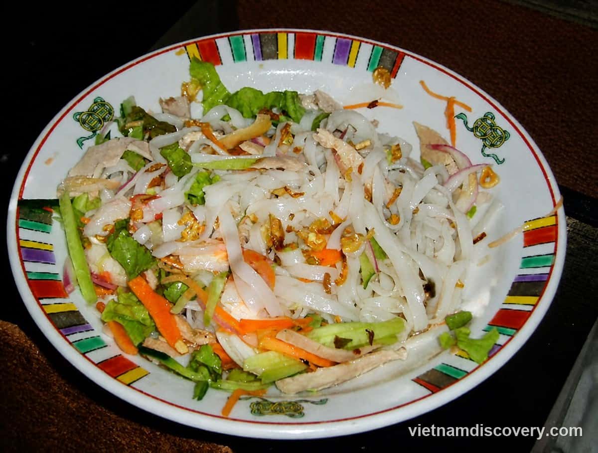 Phở chua noodles with herbs, carrot and peanuts
